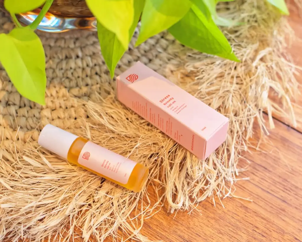 Duo Senses uplifting CBD aromatherapy roll-on on side table