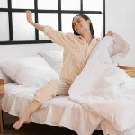 Woman waking up refreshed after using Duo Senses CBD sleep support products
